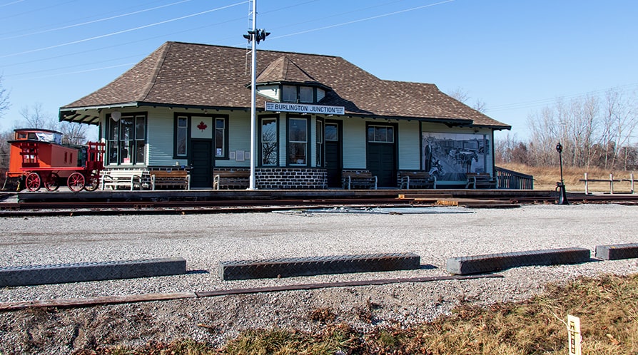 A photo out-front of the restored, historic Freeman Station.